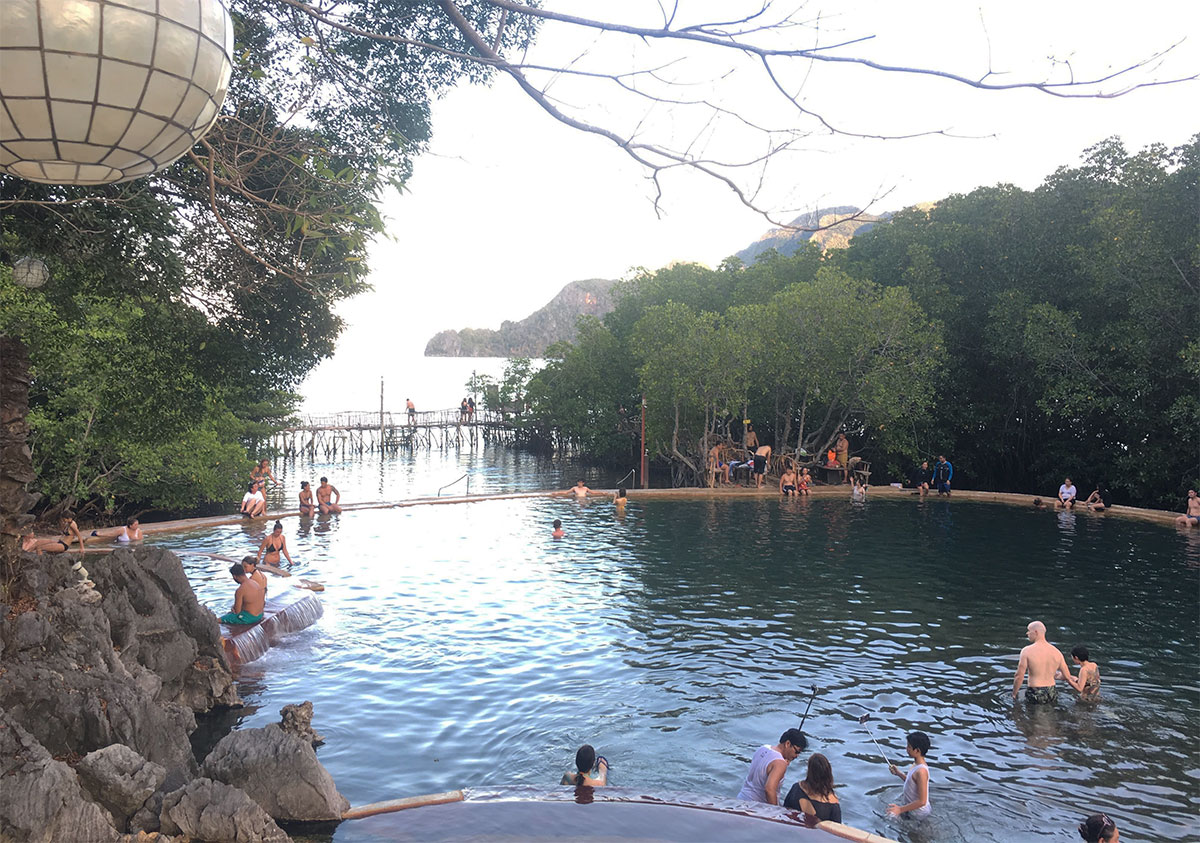 people at maquinit hot springs coron